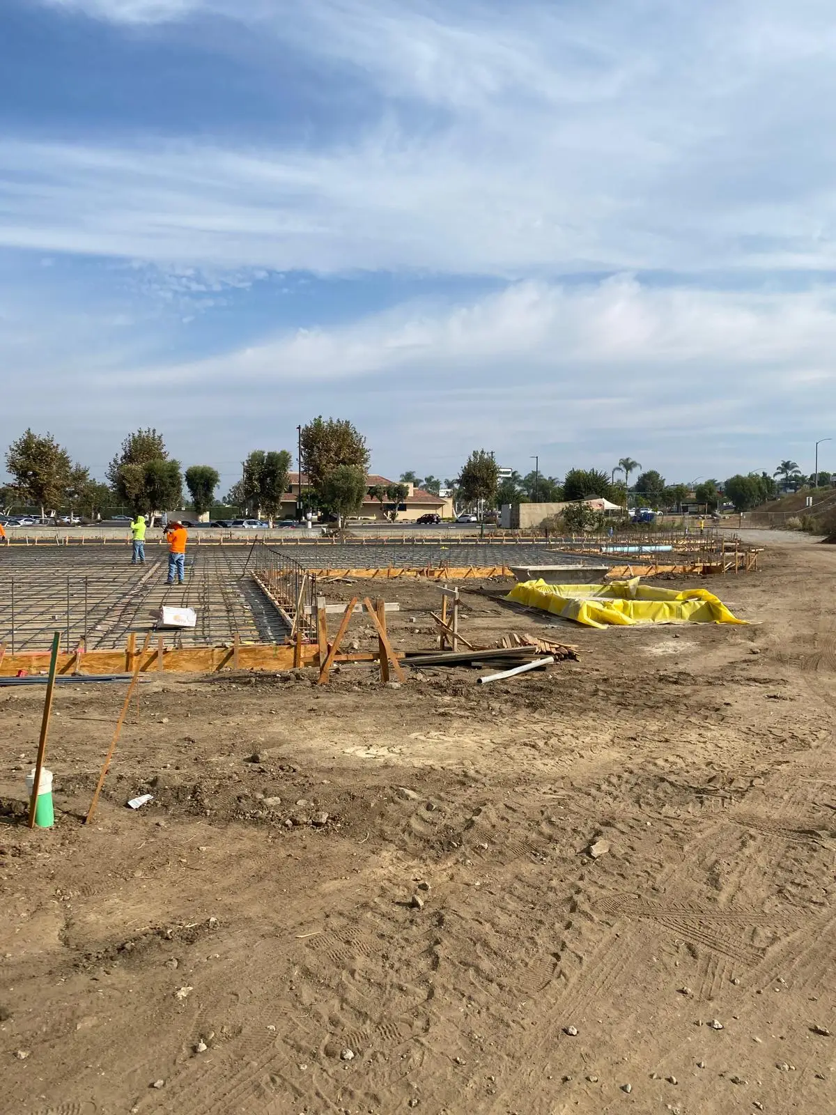 Building pad layout with forms and survey stakes