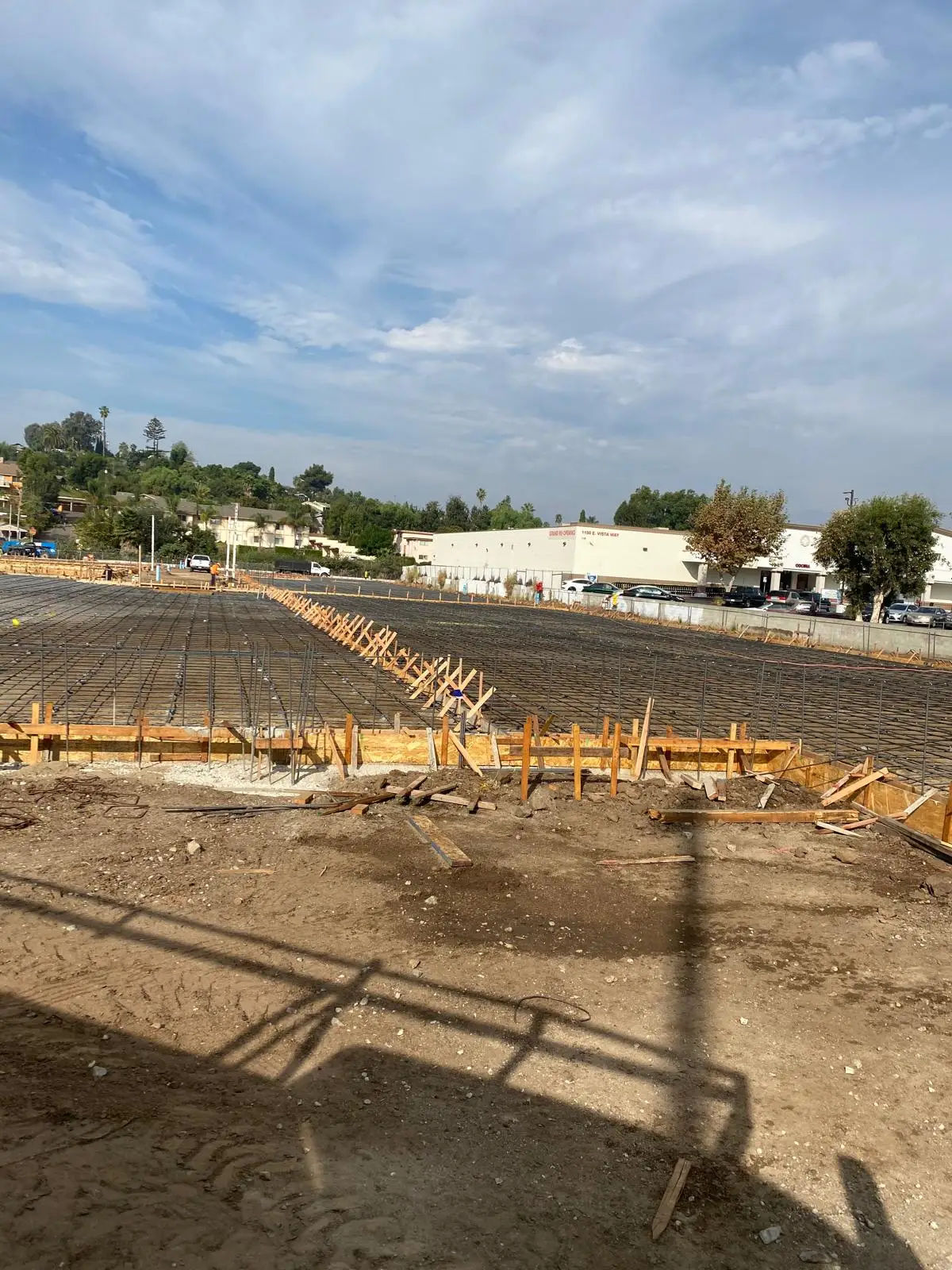 Reinforcing grid and forms in place across a building pad